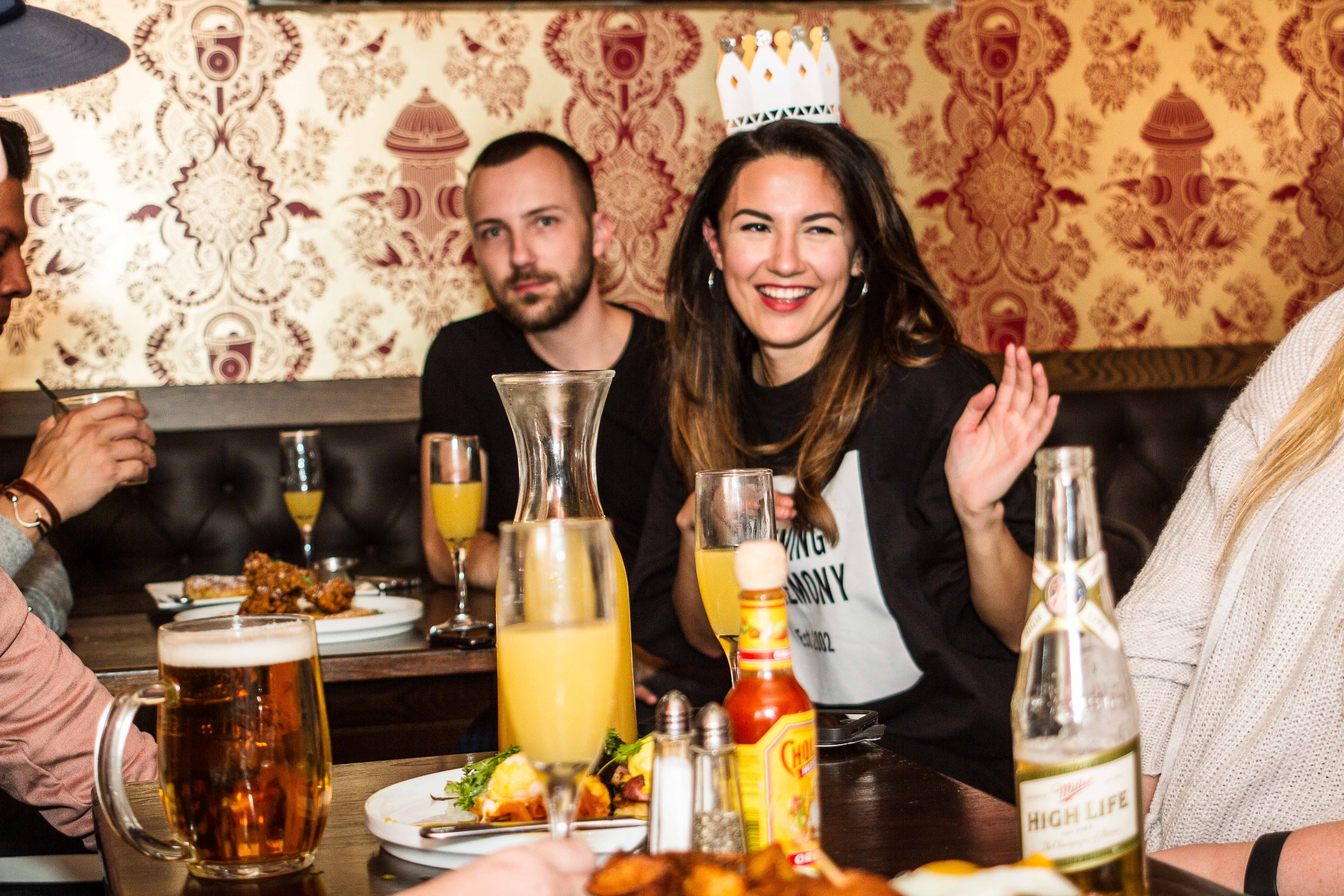 Photo of woman wearing a tiara with friends at The Winslow brunch East Village.