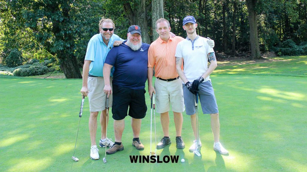 Photo of four golfers ready to play in The Winslow Charity Golf Outing