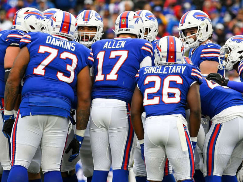 The Winslow welcomes the Bills Mafia. Photo of the back of the Bills players in a huddle at a game.
