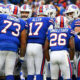 The Winslow welcomes the Bills Mafia. Photo of the back of the Bills players in a huddle at a game.