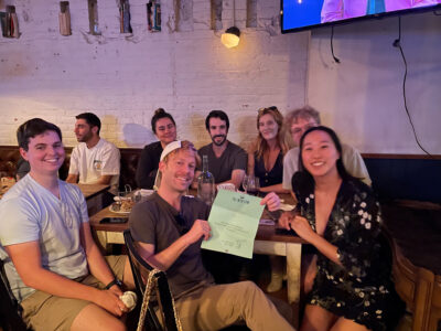 Trivia winner holding a certificate from the winslow for their prize