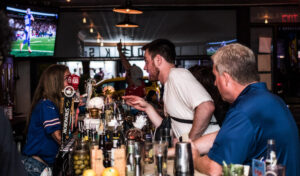 British pub in NYC with people socializing at the bar