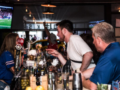 British pub in NYC with people socializing at the bar