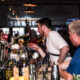 British pub in NYC with people socializing at the bar